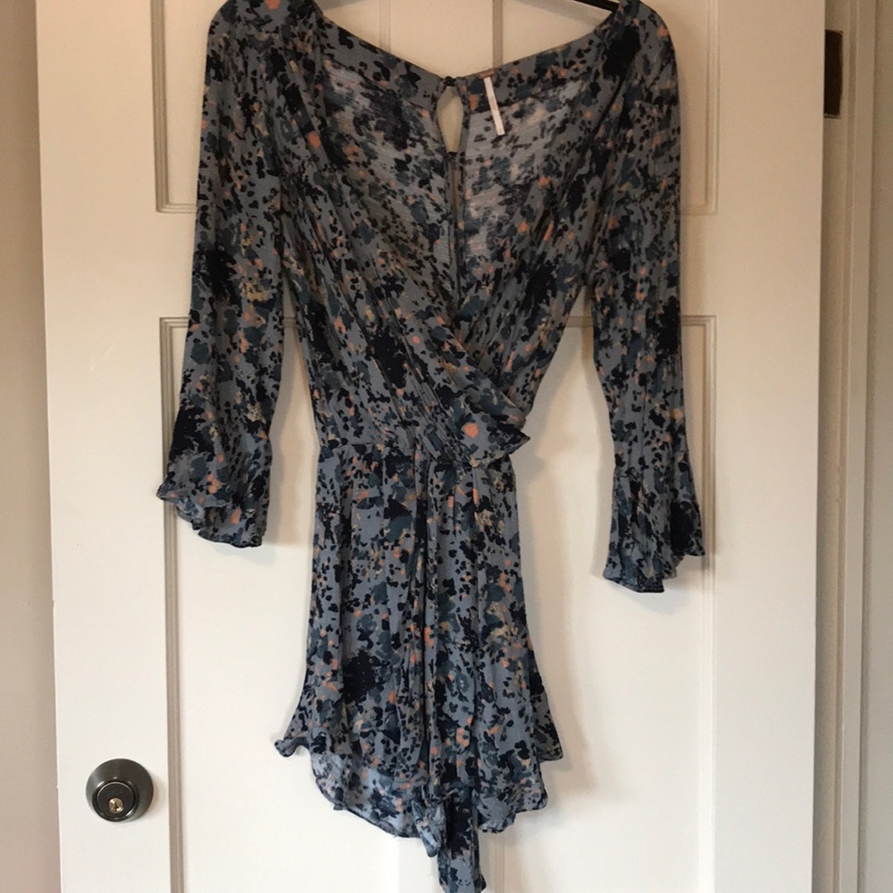 Wrap around Free People patterned romper!